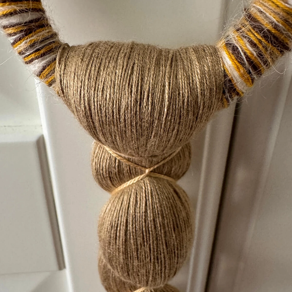 Senda tassel Handcrafted textile ornament in natural fibers